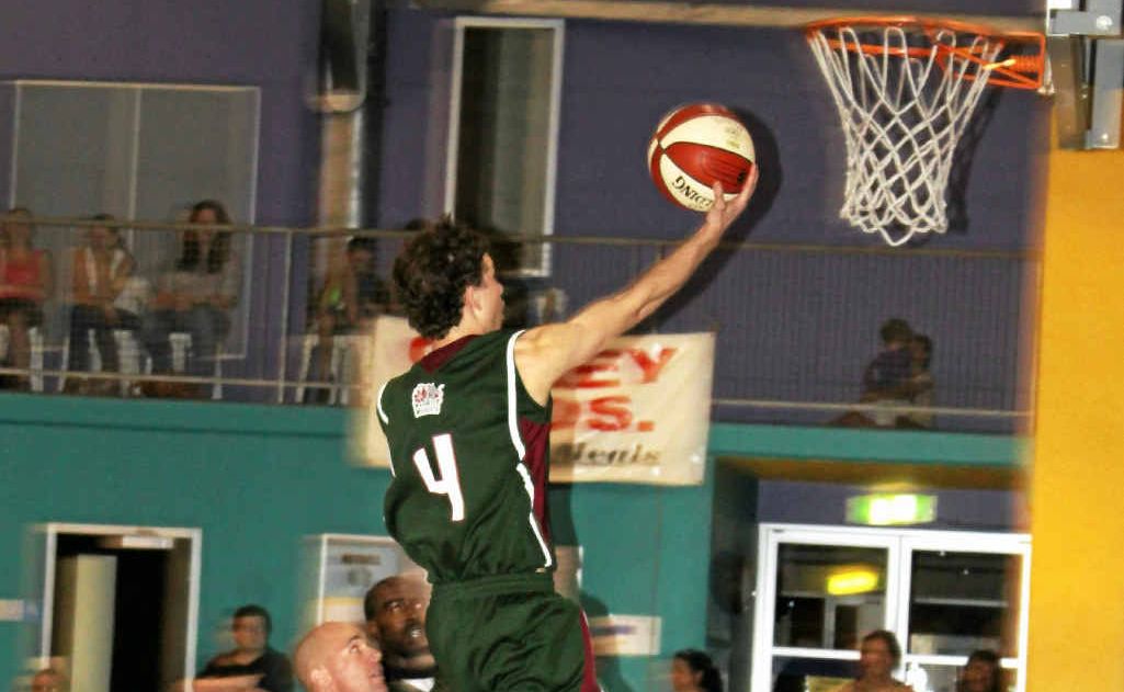 Dominic Cremasco jumps high for a basket. Dominic Cremasco jumps high for a basket.